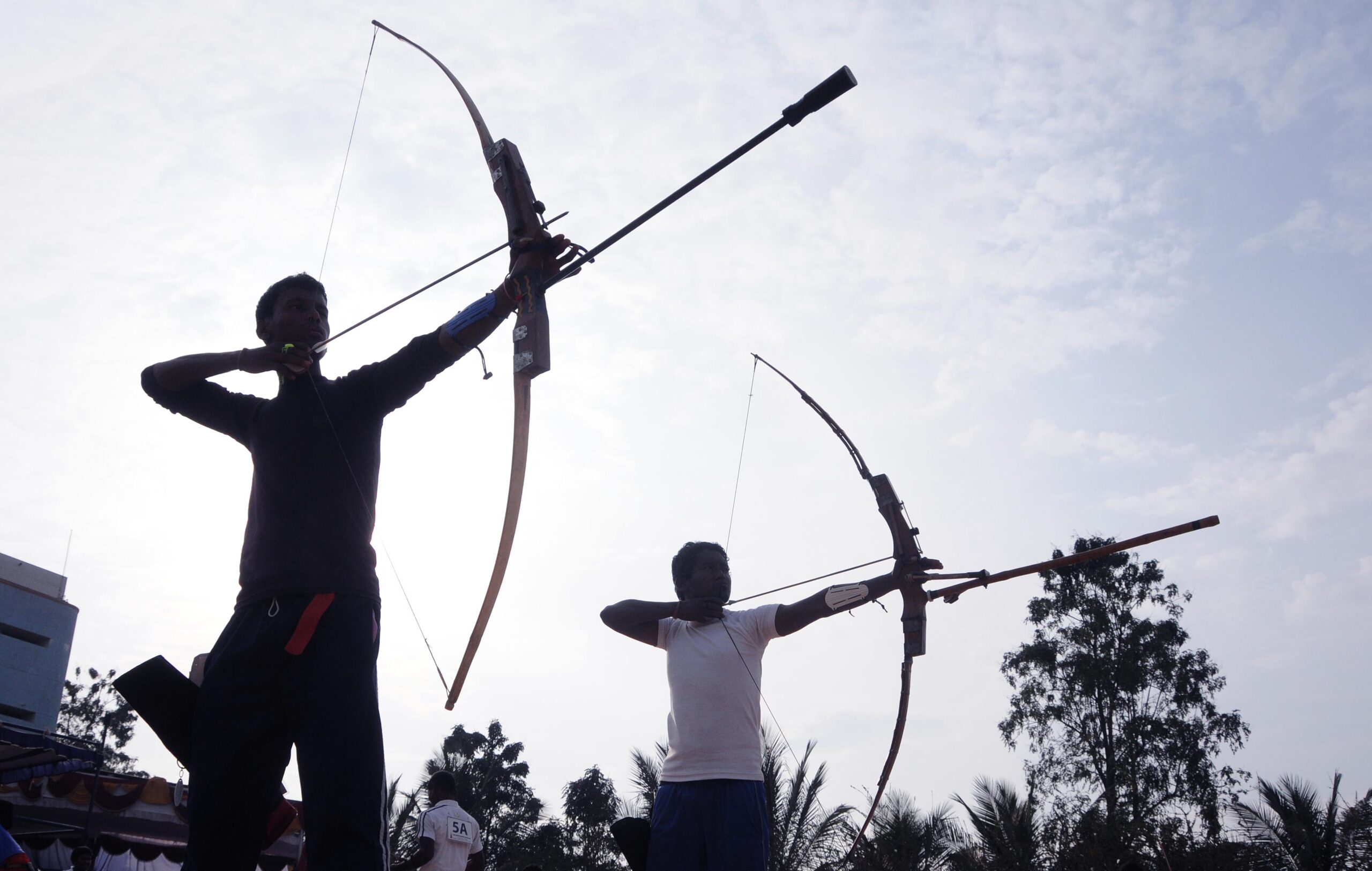 Participants in action, during 2nd day of the 17th National Varanasi Archery Competition organized by Akhil Bharatiya Varanasi Kalyan Ashram at Vagedvi School, in Bangalore on 27th of December 2014